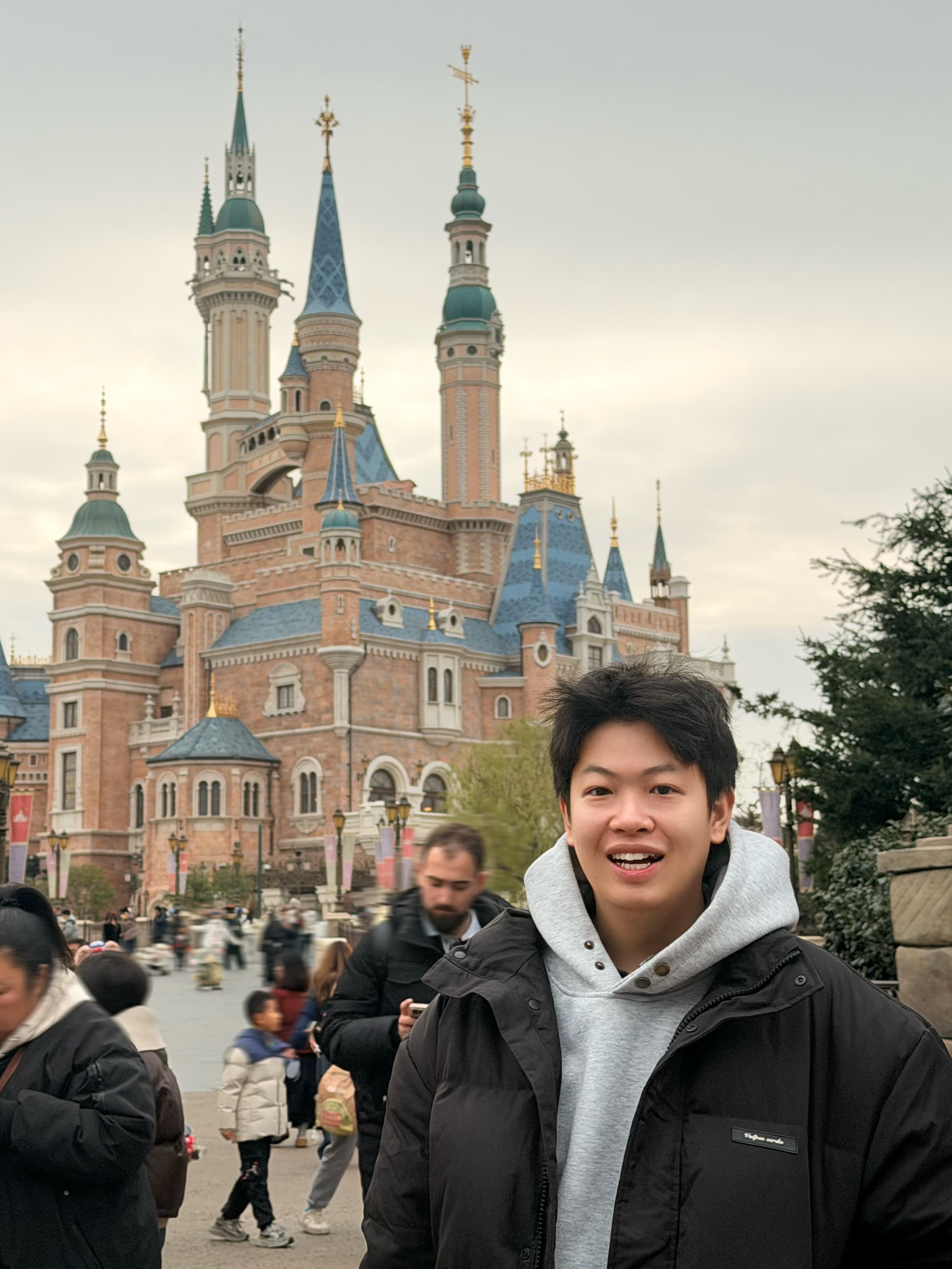 Howard smiling in front of a castle