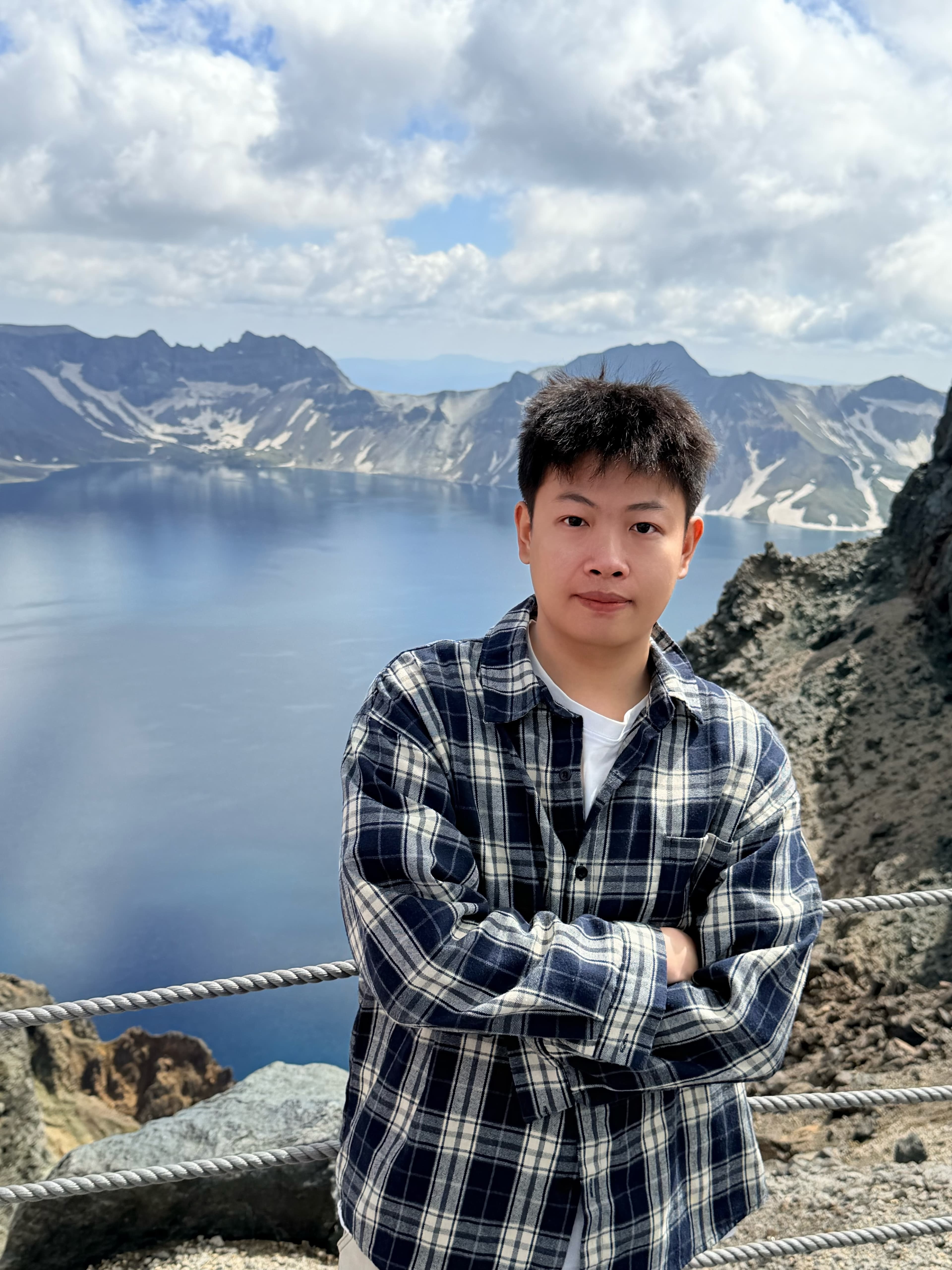 Howard beside a mountain lake